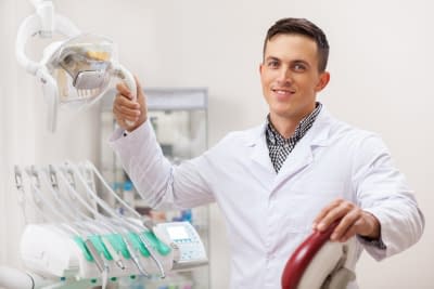 Cheerful male dentist smiling